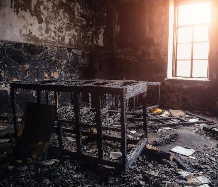 "interior view of a room with items completely destroyed by fire  "   